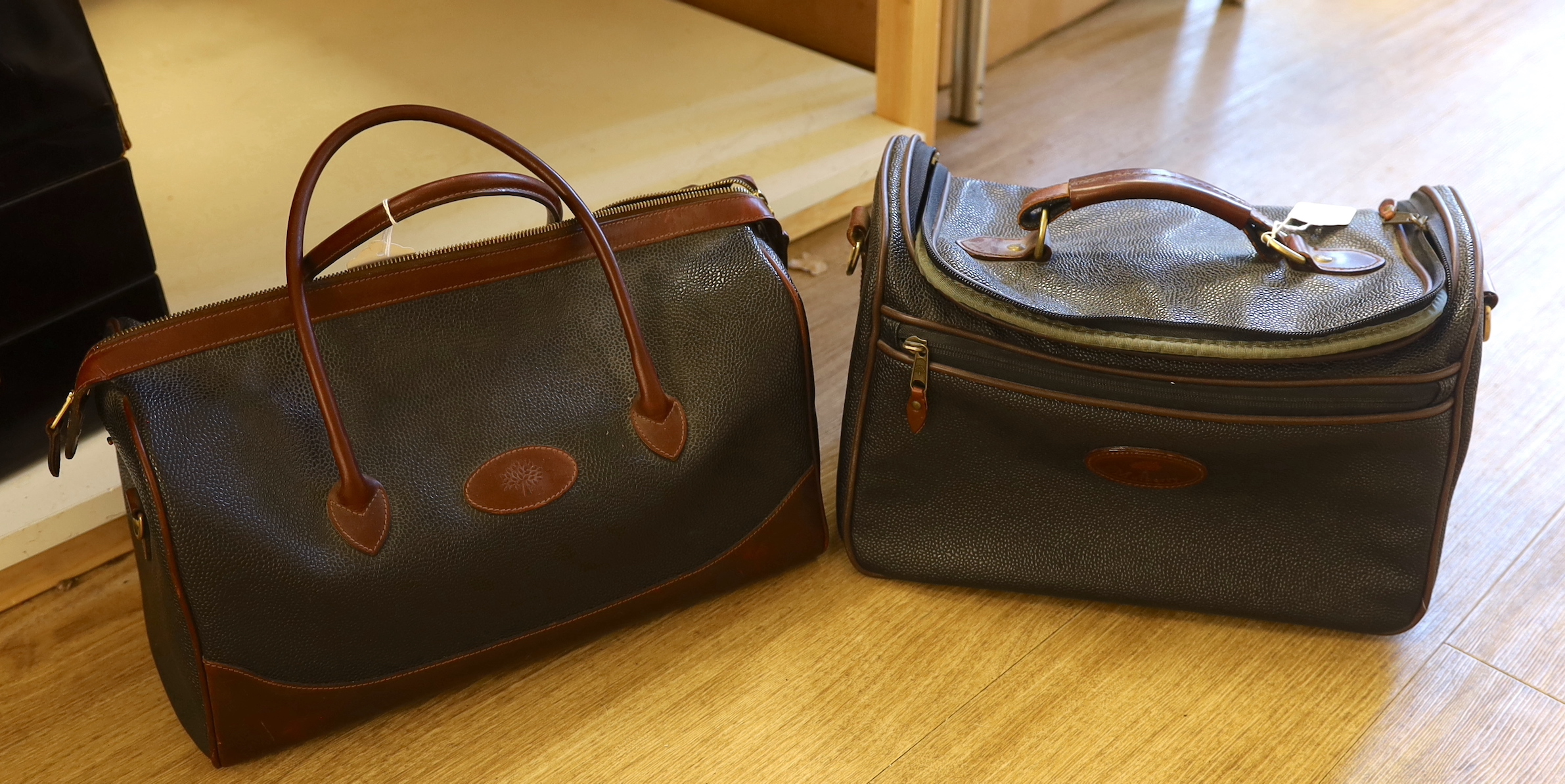 Two Mulberry Scotchgrain holdalls with tartan interiors, the largest 43cm wide